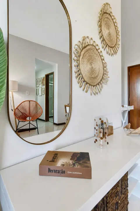 Sala de apartamento de temporada decorada pela RIOS em Cabo Frio