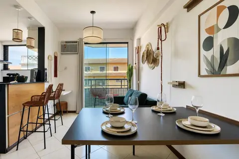 Sala de apartamento de temporada decorada pela RIOS em Cabo Frio