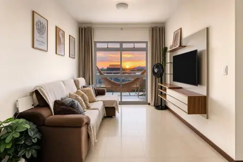 Sala de apartamento de temporada decorada pela RIOS em Cabo Frio