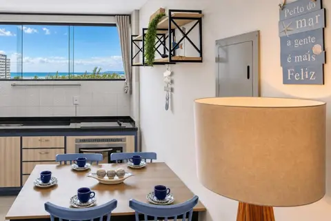 Sala de apartamento de temporada decorada pela RIOS em Cabo Frio